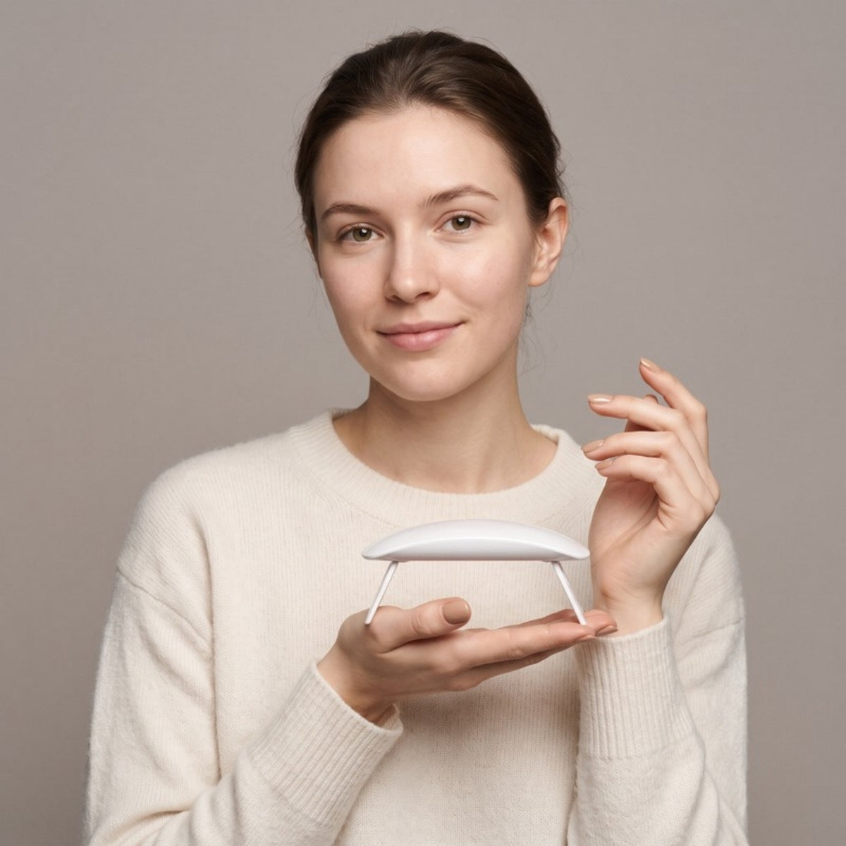 Model holding the Polish Mini UV LED Nail Lamp