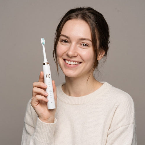 Model holding the Bright Sonic Electric Toothbrush