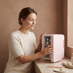 Model using the Chill Mini Skincare Fridge