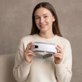 Model holding the Rest Air Pressure Eye Massager