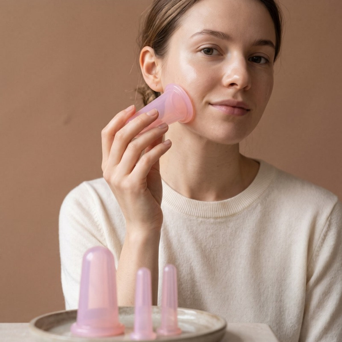 Model using the Sculpt Facial Cupping Set