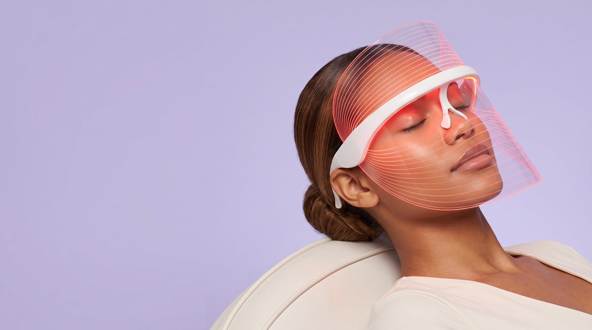 Woman relaxing in the Asetics Glow LED Face Mask